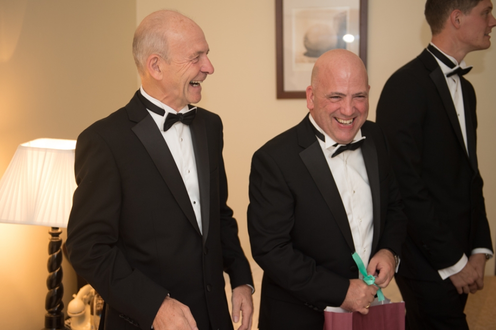 Father of the Groom and Father of the Bride laughing together