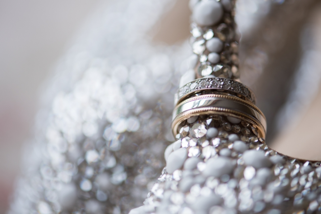 Wedding bands sitting on the brides jewelled heel