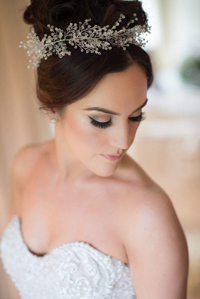Birde wearing her bridal head piece and wedding dress