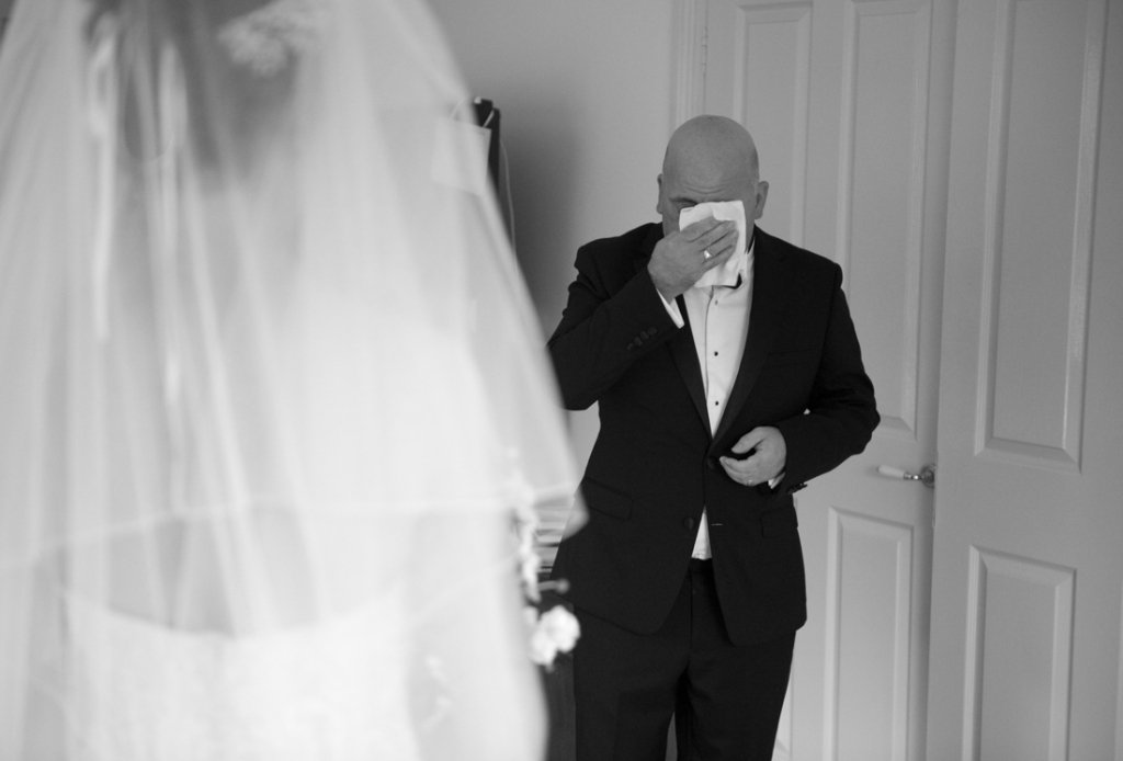 Emotional Father of the Bride seeing his daughter in her wedding dress
