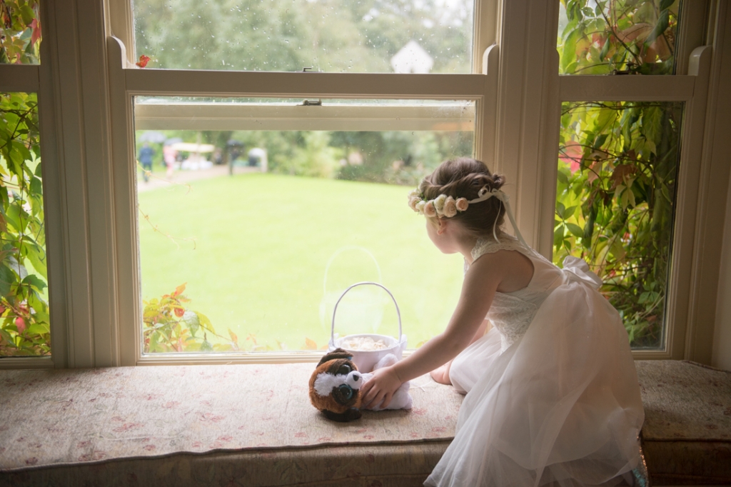 Flower girl looking out the window