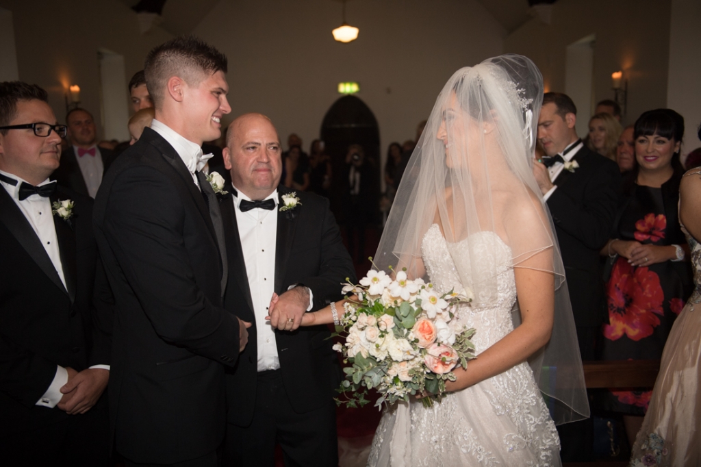 Father of the Bride giving his daughter away at the top of the aisle