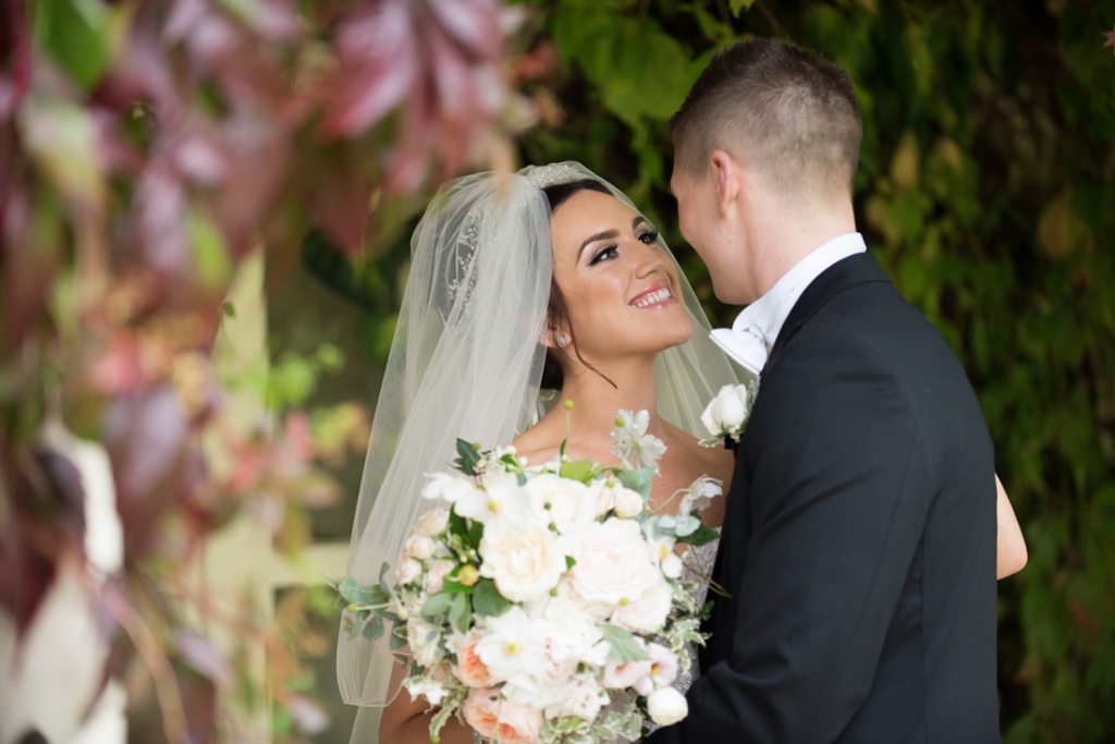 Bride and groom smiling for their Brooklodge wedding photographs