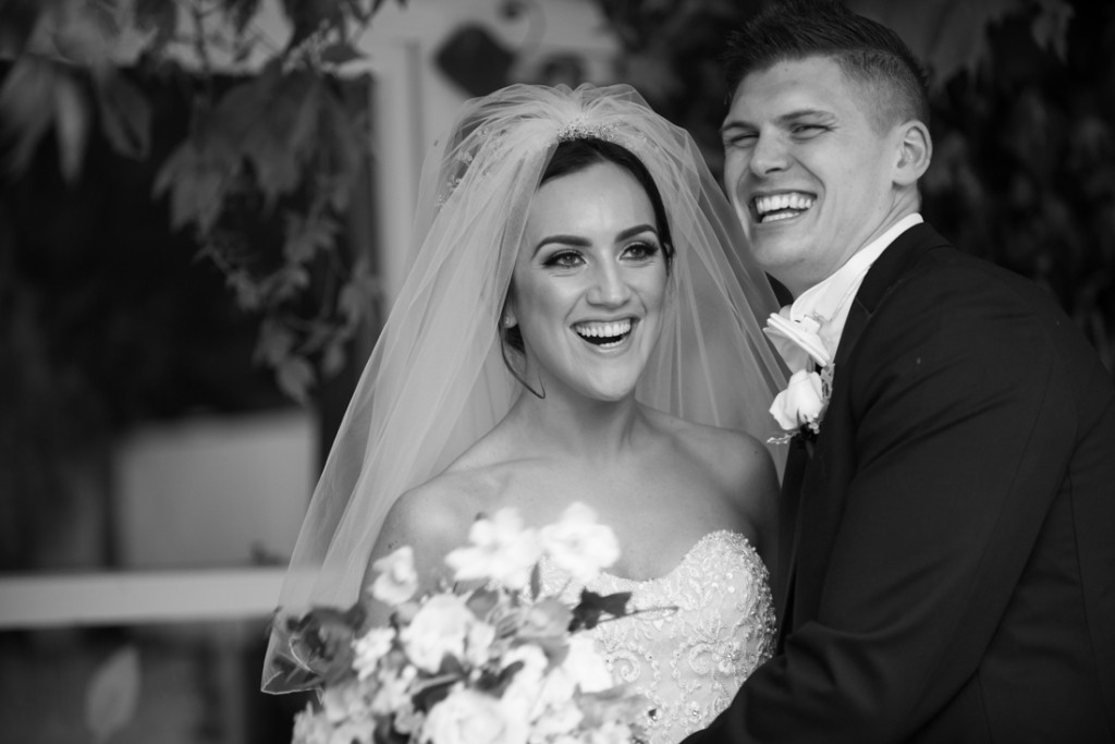 Bride and groom laughing together