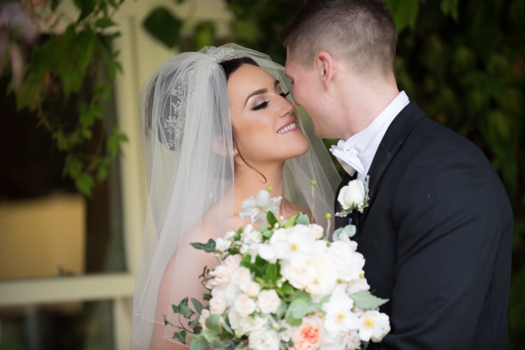 Bride and groom kissing 