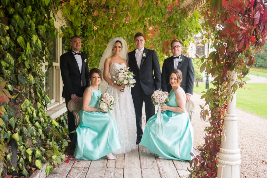 Bride and groom and their bridal party on the boardwalk at brooklodge