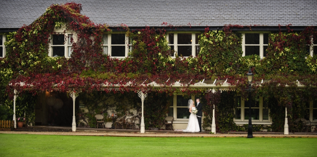 Bride and groom standing under the boardwalk at the Brooklodge Hotel