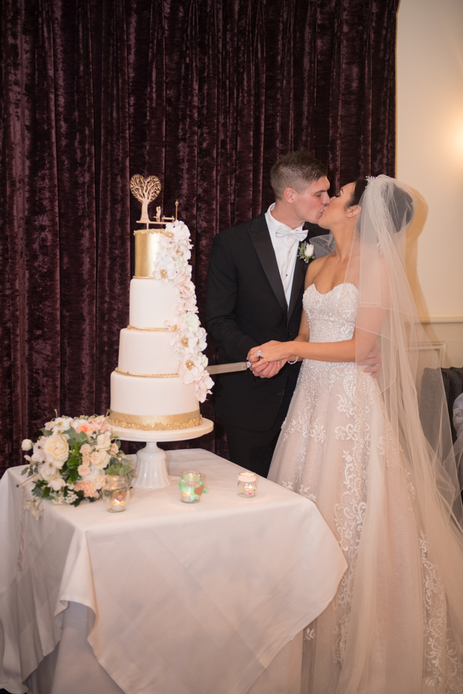 Bride and groom cutting the cake