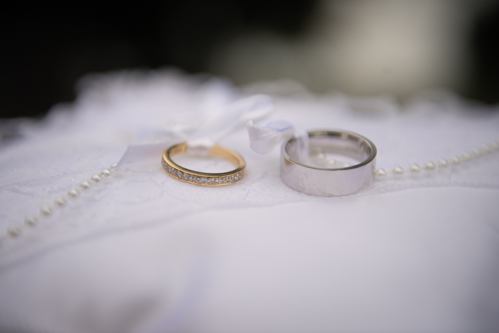 radisson blu wedding rings on cushion by wedding photographers the fennells