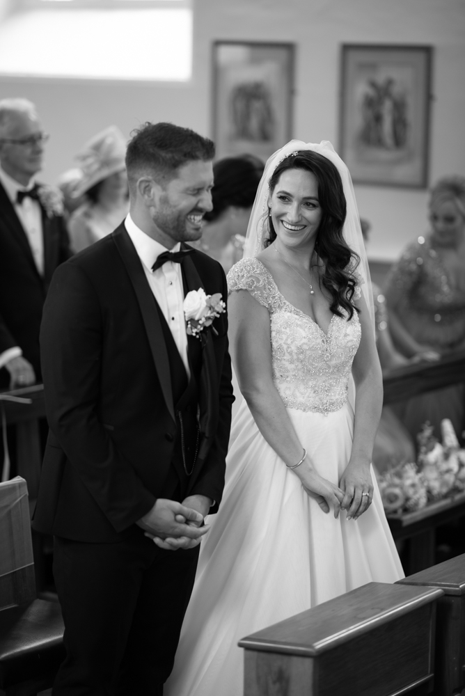 couple laughing by wedding photographers the fennells