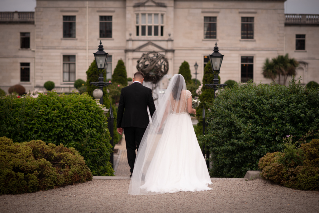 radisson blu wedding walking to the party photo by wedding photographers the fennells