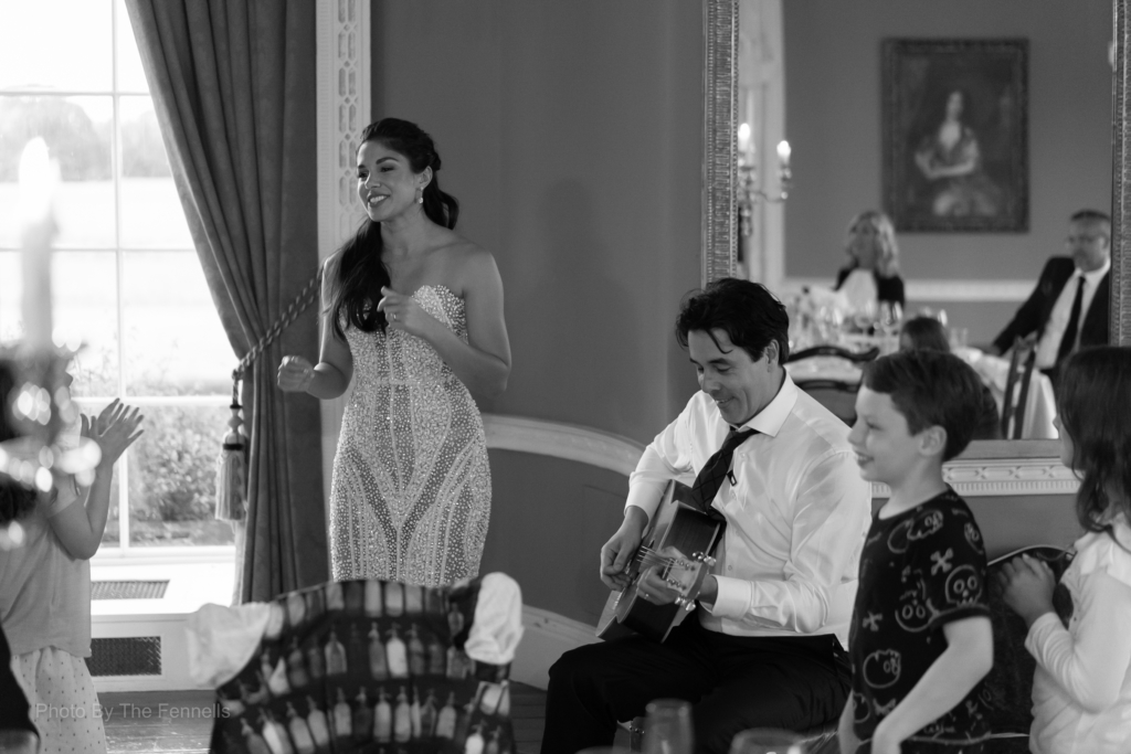 Sarah Roberts singing a song to James Stewart during their wedding speeches