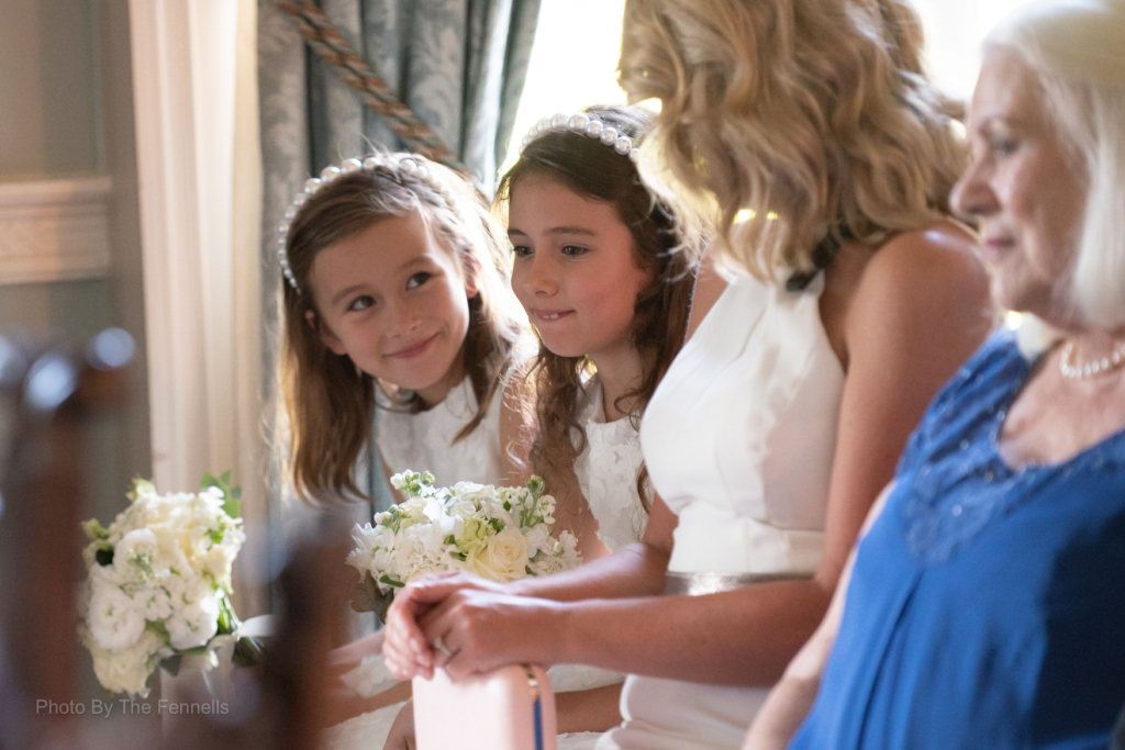 Flower girl and guests during the ceremony at the home and away wedding