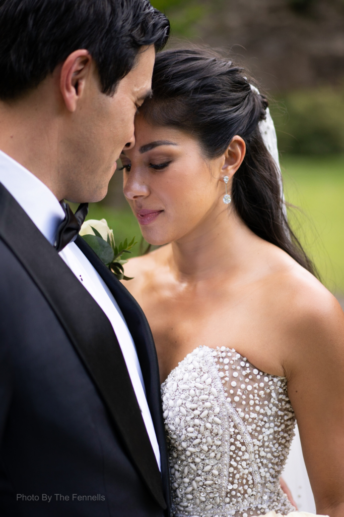 Sarah Roberts and James Stewart embracing on their wedding day at Luttrellstown Castle