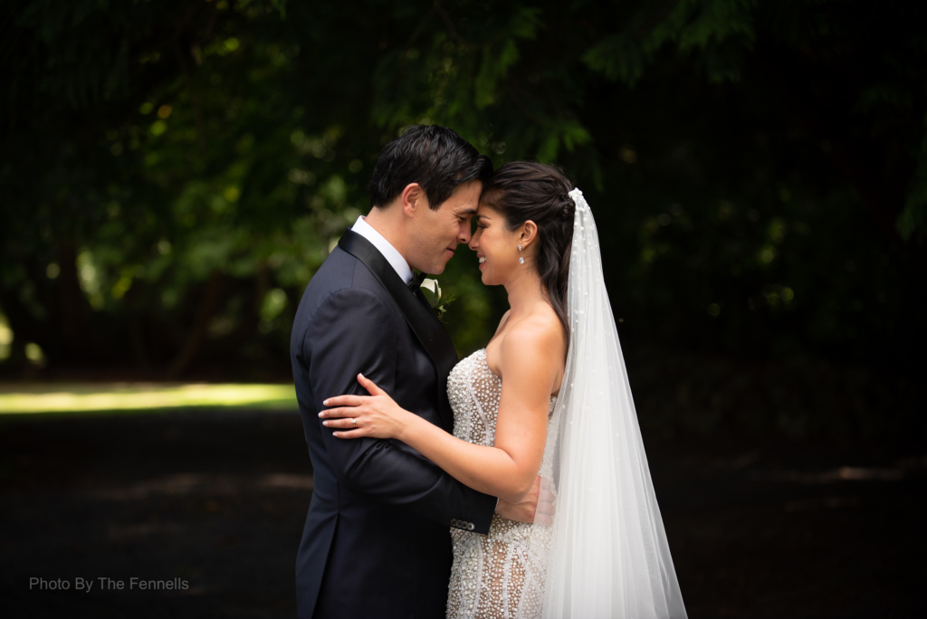 James Stewart and Sarah Roberts hugging with their foreheads touching on their wedding day