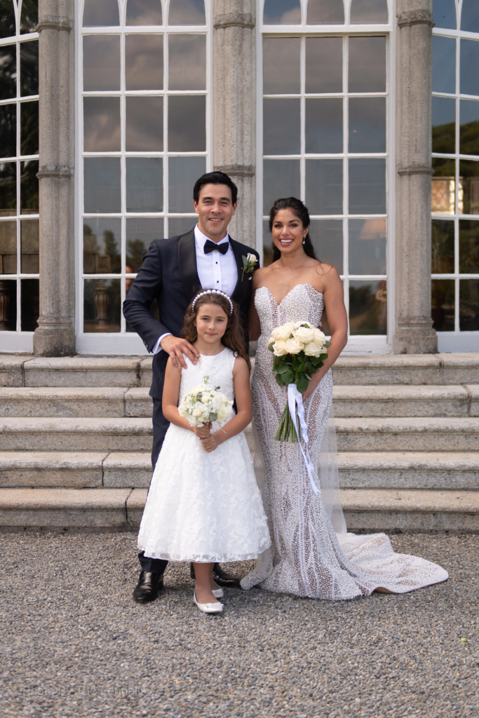 Sarah Roberts and James Stewart with his daughter at the steps of Luttrellstown Castle