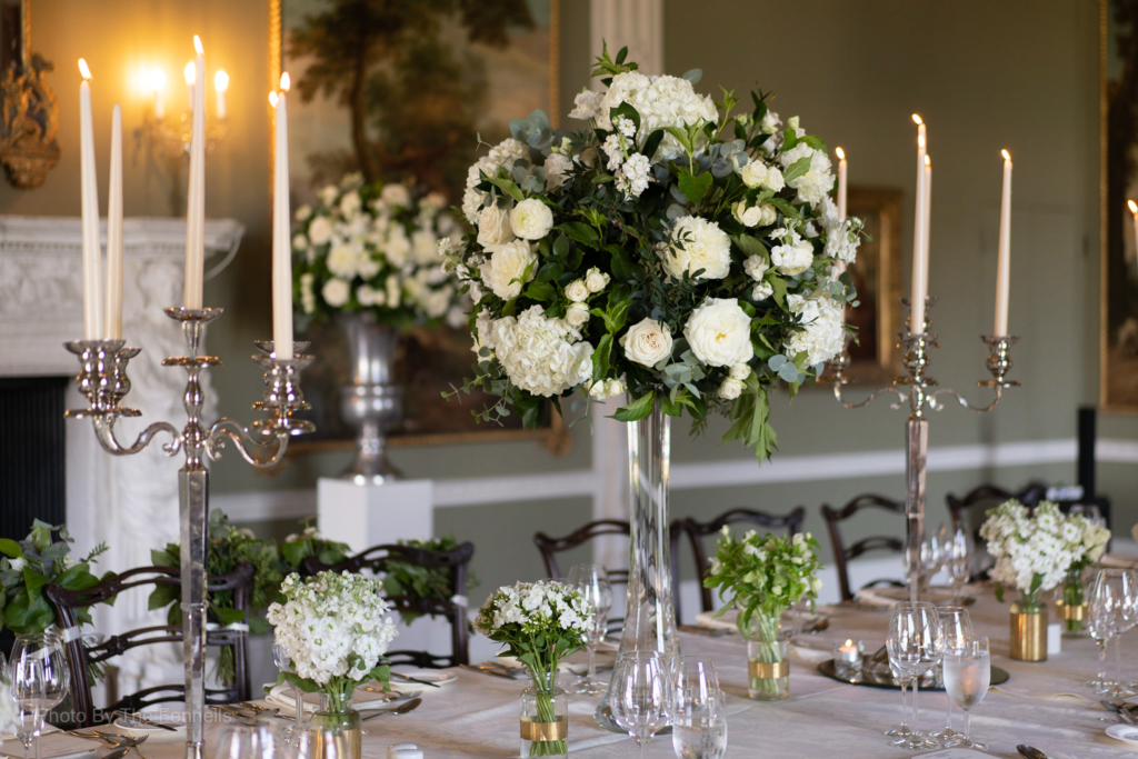 The Dinner table set with candelabras and white flowers for Sarah Roberts and James Stewarts wedding at Luttrellstown