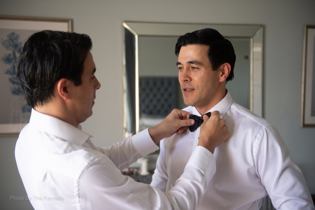 James Stewart getting his bow tie tied by his twin brother