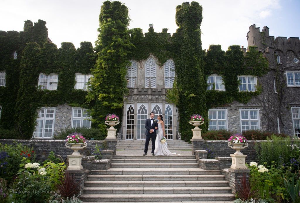 Sarah Roberts and James Stewart standing on the steps at Luttrellstown Castle