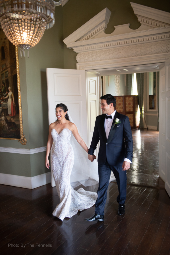 Sarah Roberts and James Stewart walking into their wedding dinner reception at Luttrellstown Castle