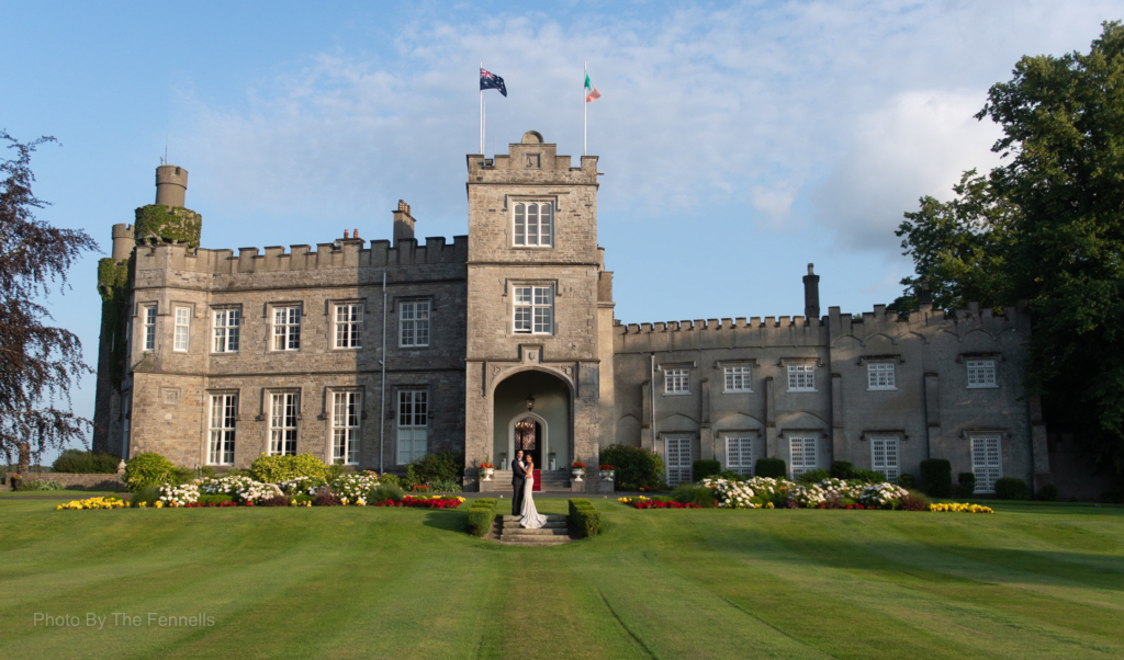 Sarah Roberts and James Stewart in front of Luttrellstown Castle on their wedding day