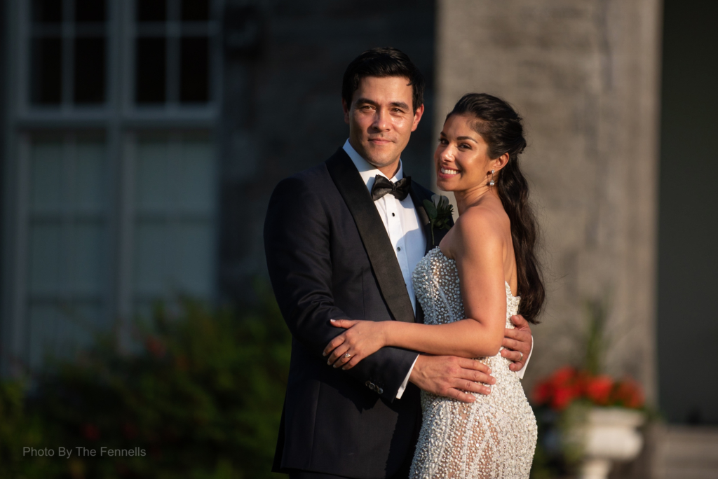 James Stewart and Sarah Roberts outside at Luttrelllstown Castle on their wedding day