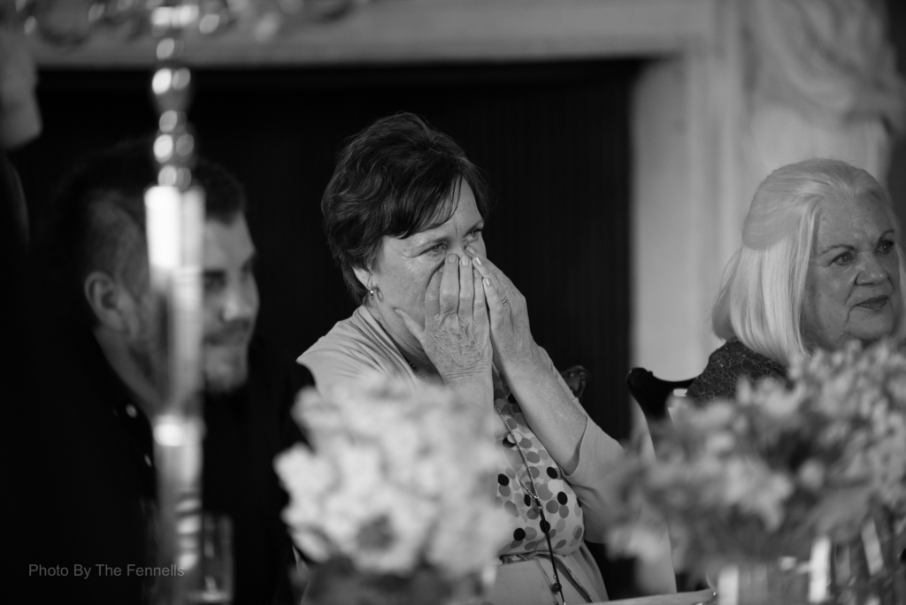 Guests listening to the wedding speeches at the home and away wedding