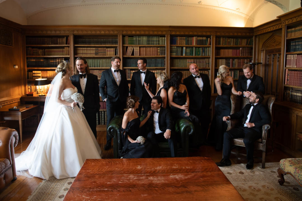 bridal party sitting and talking in luttrellstown castle library