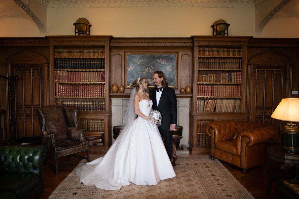 bride and groom standing together in luttrellstown castle library