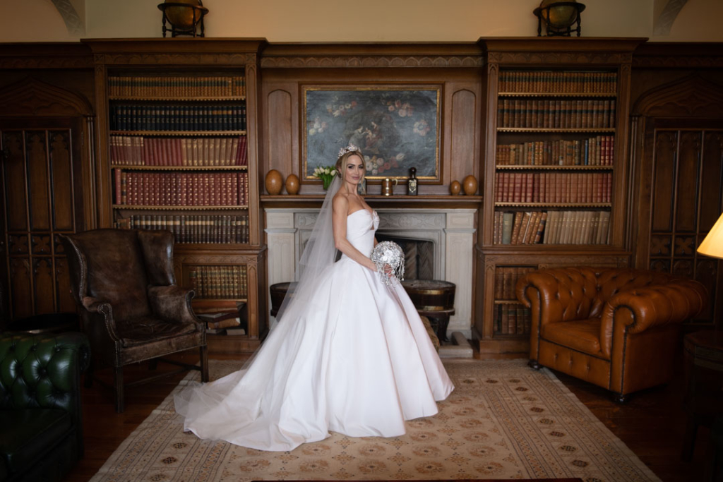 bride wearing Oscar De La Renta wedding dress in luttrellstown castle library