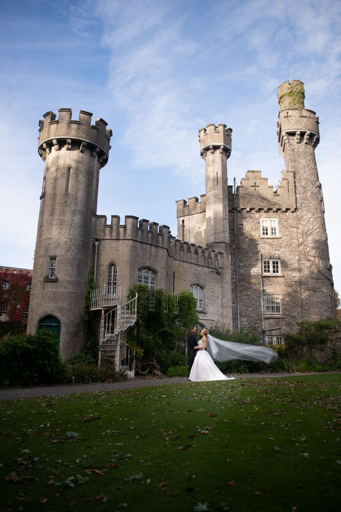 couple standing at tower outside irish castle Luttrellstown