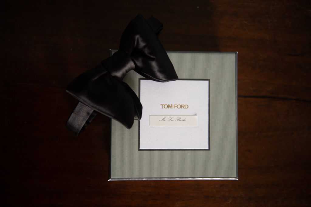 Grooms Tom Ford bow tie on table