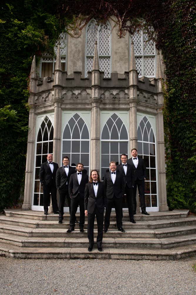 Groom and groomsmen on steps of Luttrellstown Castle