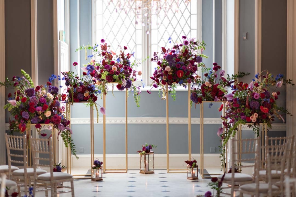 Flowers on geometric stands in ceremony room at Luttrellstown Castle