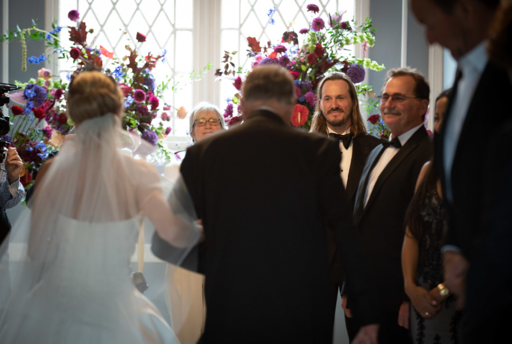 Groom looking back at Bride walking down aisle at Luttrellstown Castle