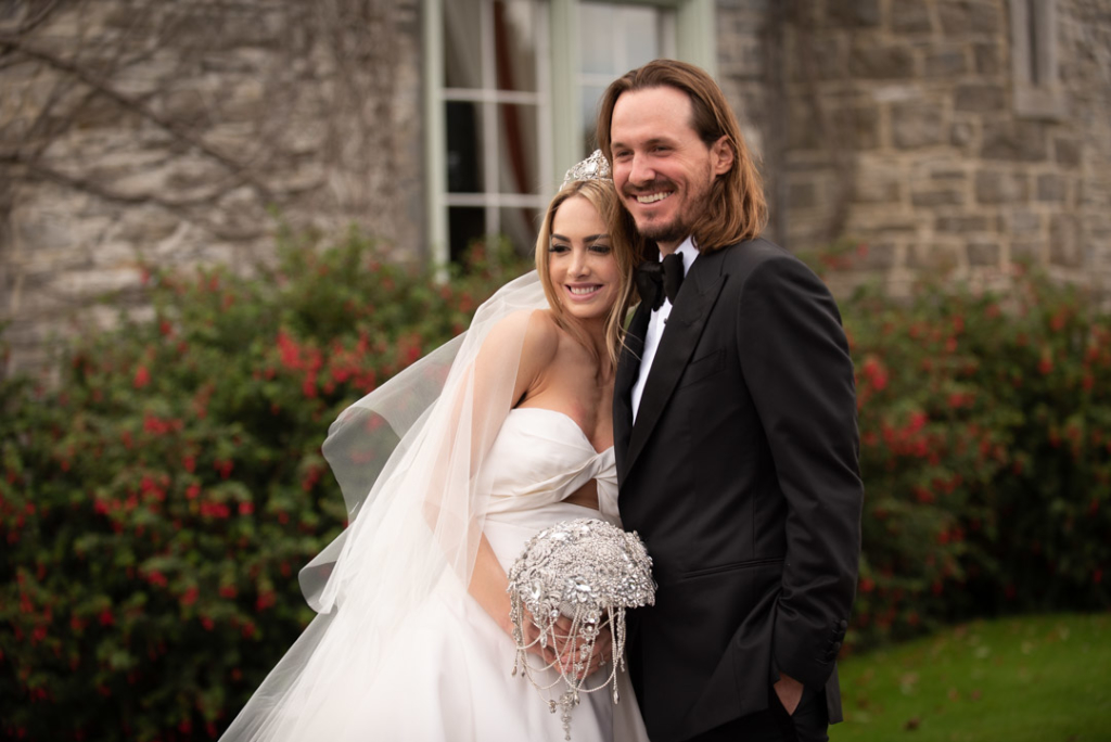 Bride and Groom hugging and smiling in garden at Luttrellstown Castle