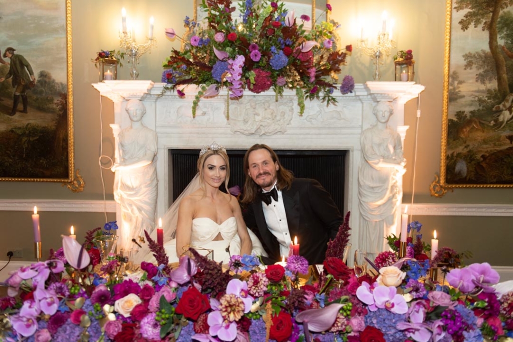 Bride and Groom sitting at top table at their Luttrellstown Castle wedding