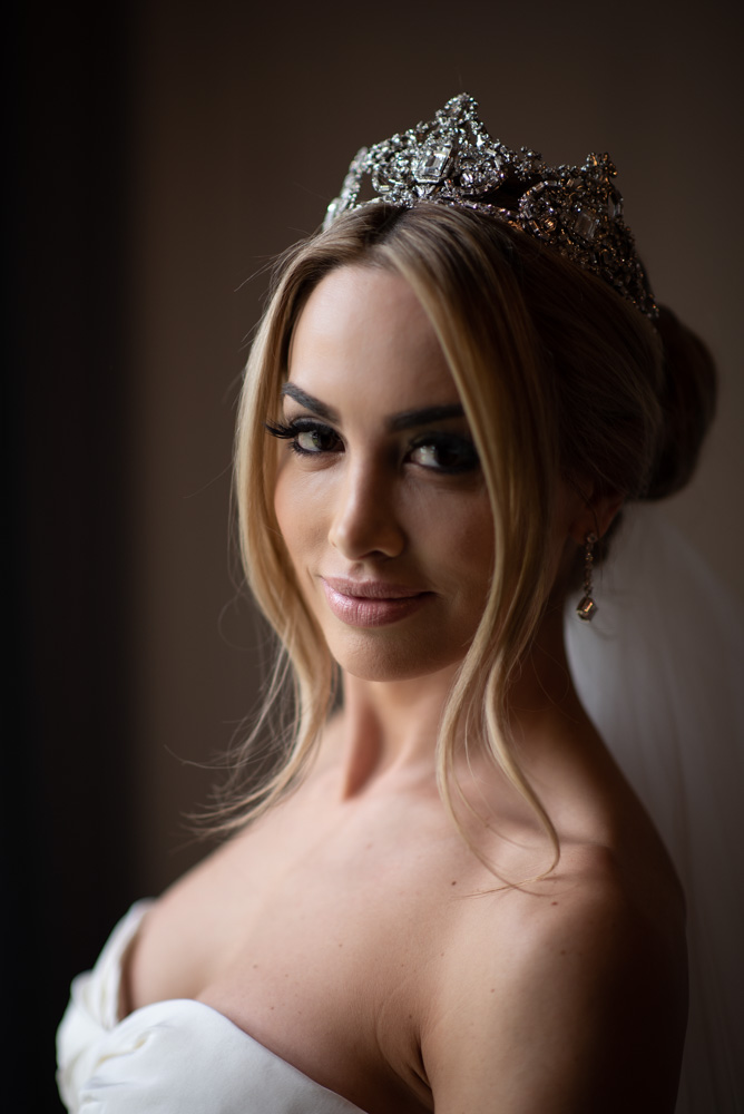 bride close up of wedding make up and hairstyle wearing diamonds