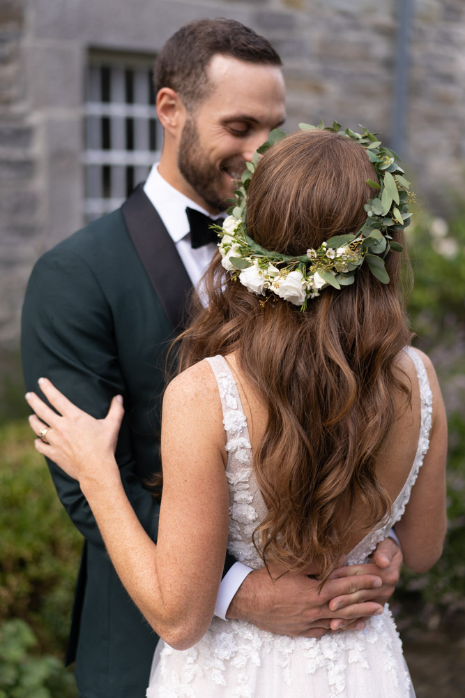 Brides long wavy red hair with flower crown at Ballymagarvey Village wedding