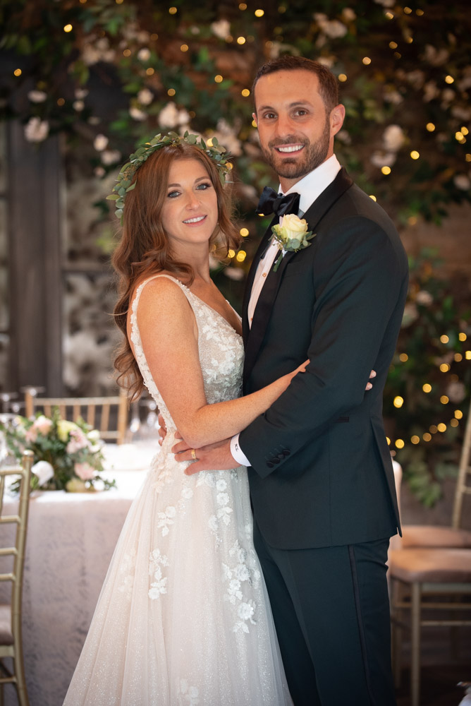 Bride and groom smiling looking at camera in Ballymagarvey Village