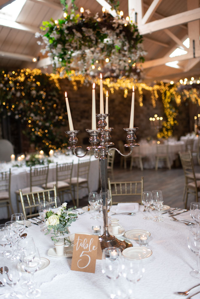 Silver candelabra with white candles in Ballymagarvey Reception room with summer decor