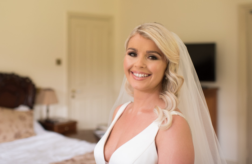 Bride in her wedding dress smiling