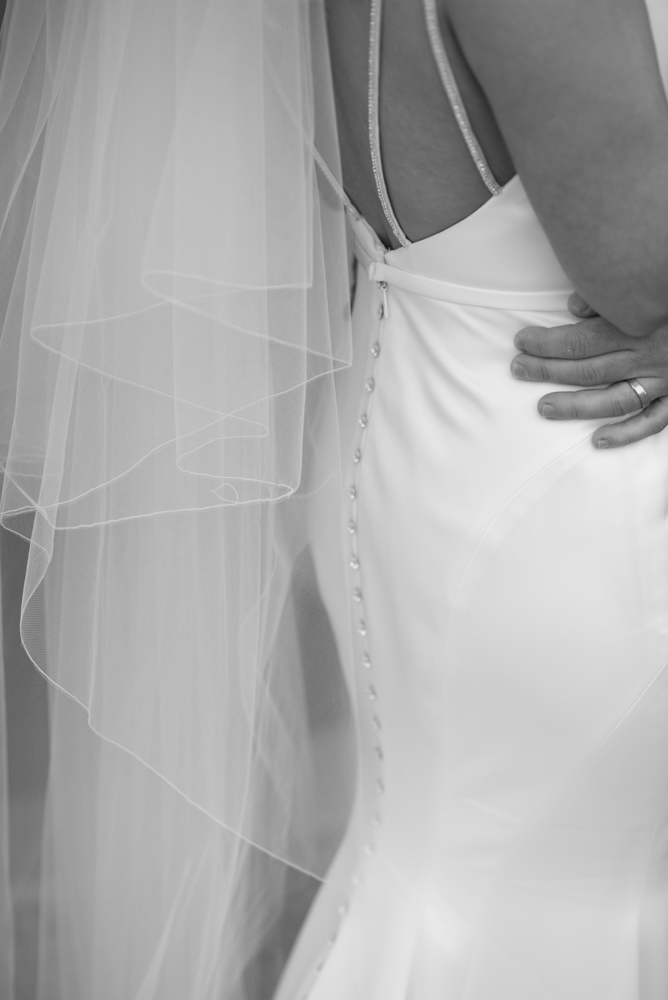 Close up of the buttons on the back of Brides dress