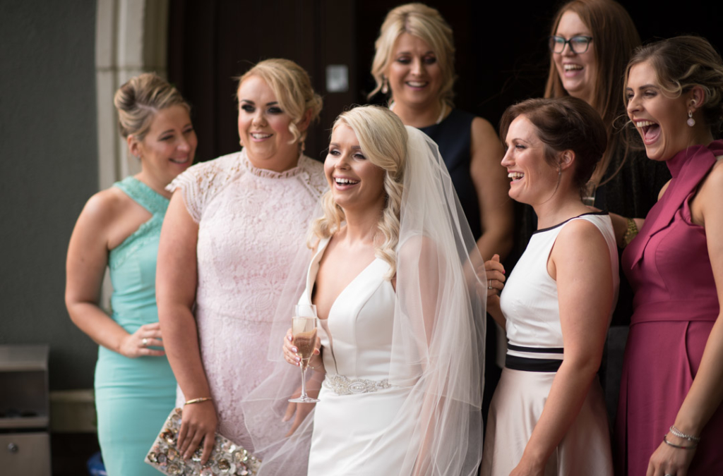 Bride laughing with her friends