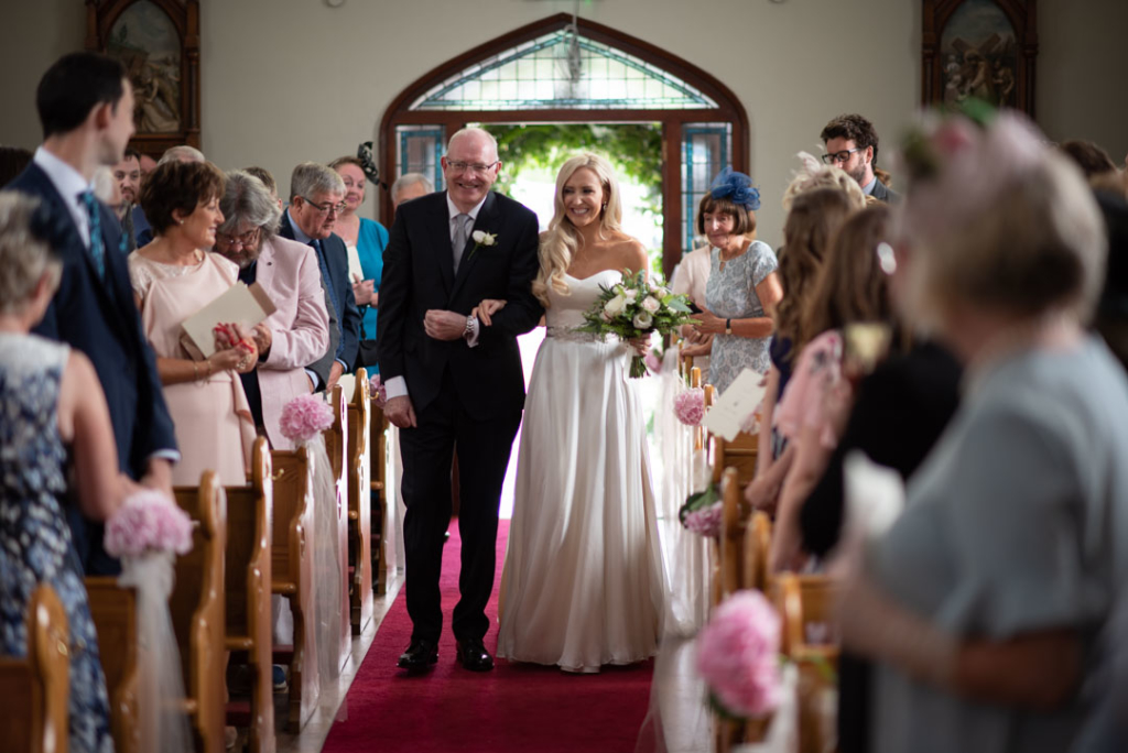 Bride and her dad walking down the Church aisle