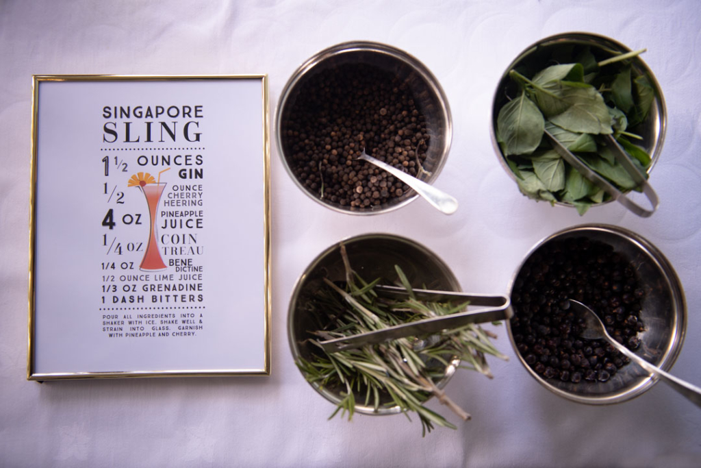 A recipe for a Singapore sling gin drink with fresh herbs