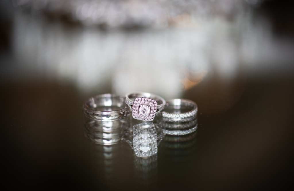 Brides diamond engagement and wedding ring and grooms wedding ring