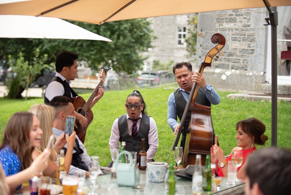 Musicians entertaining the guests at the wedding drinks reception at the Mill House Slane