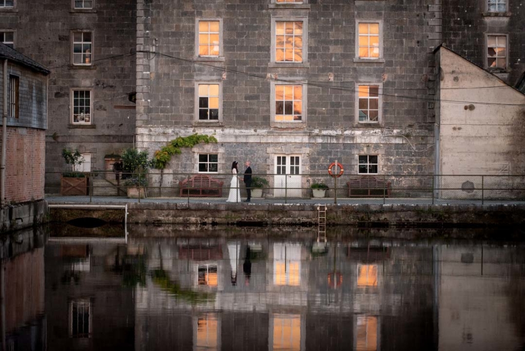 Bride and groom standing in front of the Mill House Slane