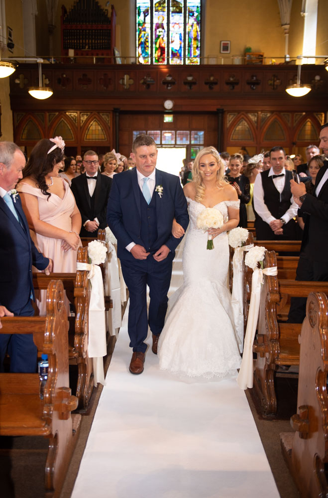 Bride and her dad walking up the Church aisle